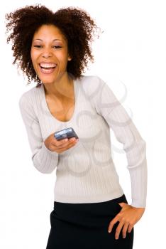 Smiling young woman using a PDA isolated over white