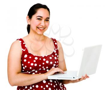 Woman using a laptop and smiling isolated over white