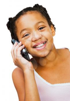 Smiling girl using a mobile isolated over white