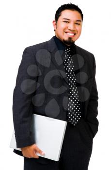 Smiling businessman holding a laptop and posing isolated over white