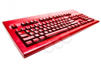 Computer keyboard of red color isolated over white