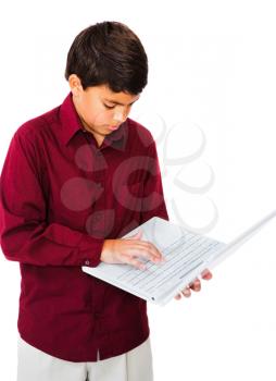 Boy using a laptop isolated over white