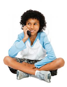 Boy using a mobile phone isolated over white