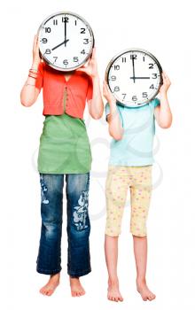 Caucasian girls holding clocks isolated over white