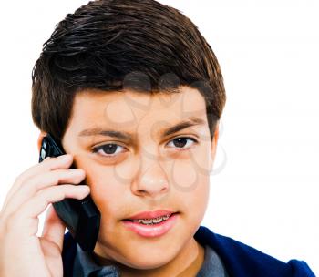 Close-up of a boy using a mobile phone isolated over white