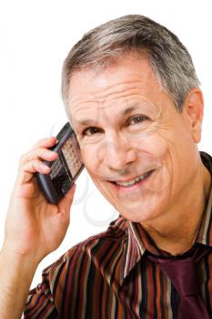 Smiling businessman talking on a mobile phone isolated over white