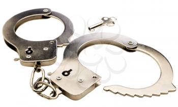 Key near handcuffs isolated over white
