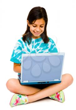 Girl using a laptop and smiling isolated over white