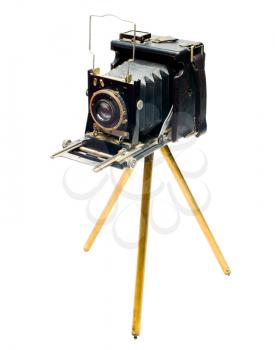Retro camera on a tripod isolated over white