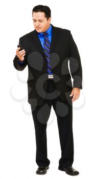 Businessman on the mobile phone isolated over white