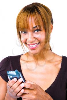 Portrait of a woman text messaging with a mobile phone isolated over white
