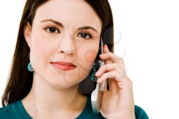 Woman talking on a mobile phone isolated over white