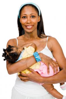 Close-up of a woman carrying her daughter and smiling isolated over white