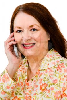 Mature woman talking on a mobile phone isolated over white