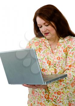 Close-up of a mature woman using a laptop isolated over white