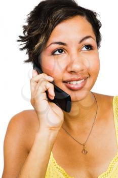 Happy woman talking on a mobile phone isolated over white