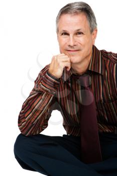 Portrait of a sitting businessman smiling isolated over white
