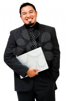 Happy businessman holding a laptop and posing isolated over white