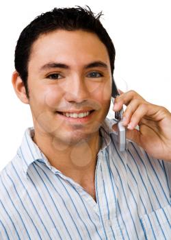Young man talking on a mobile phone isolated over white