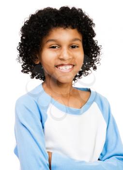 Portrait of a boy with her arms crossed and smiling isolated over white