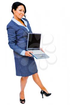 Confident businesswoman holding a laptop and smiling isolated over white