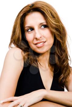 Mid adult woman day dreaming and smiling isolated over white
