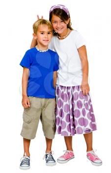 Portrait of a brother and a sister posing and smiling isolated over white
