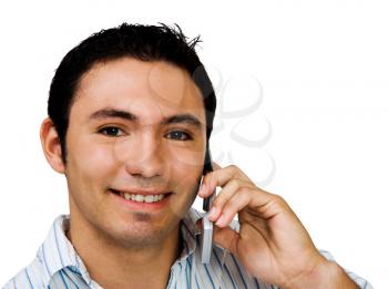 Man talking on a mobile phone and smiling isolated over white