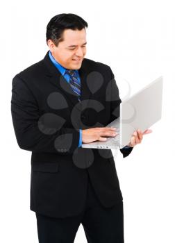 Happy businessman working on a laptop isolated over white
