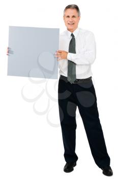 Portrait of a businessman showing a placard isolated over white