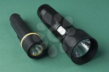 Close-up  of two flashlights