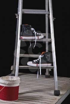 Shoes on a step ladder