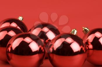 Close-up of five red baubles