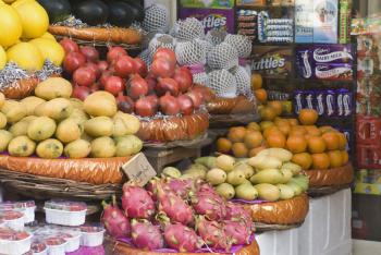 Fruits for sale at a market stall, New Delhi, India