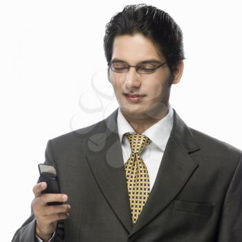 Businessman looking at a mobile phone
