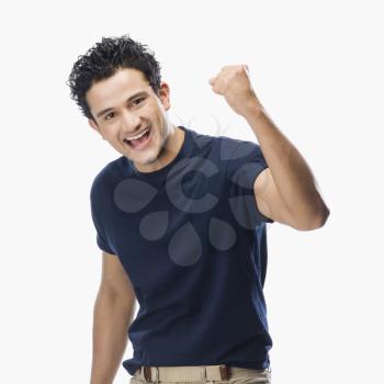 Portrait of a man making fist and smiling