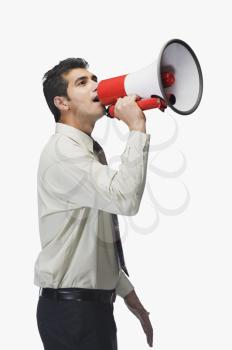 Businessman announcing into a megaphone