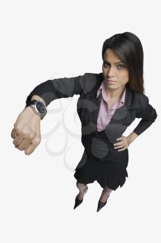 Businesswoman showing a wristwatch