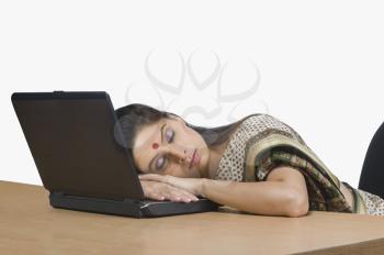 Businesswoman sleeping in an office