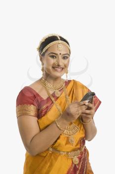 South Indian woman using a mobile phone