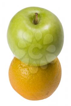 Close-up of an orange and a green apple
