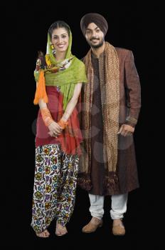 Portrait of a Sikh couple smiling