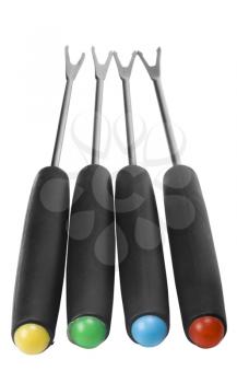 Close-up of fondue forks in a row