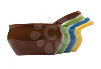 Close-up of ceramic bowls and soup spoons