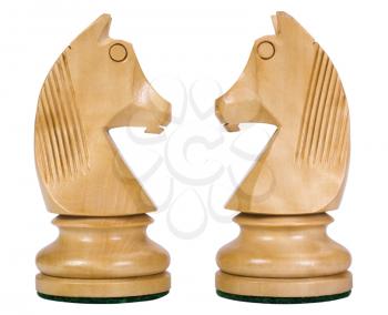 Close-up of two knight chess pieces