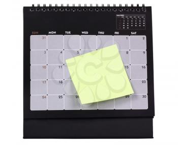 Adhesive note attached with a calendar