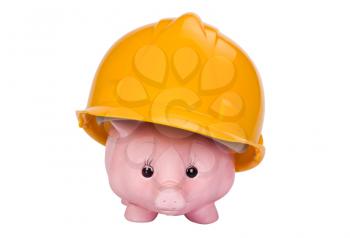 Close-up of a piggy bank with a hardhat