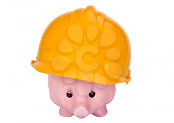 Close-up of a piggy bank with a hardhat