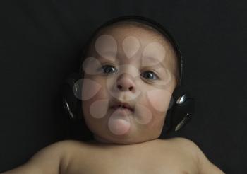 Baby boy listening to headphones