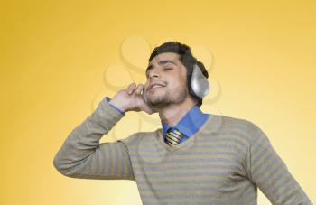 Businessman listening to headphones